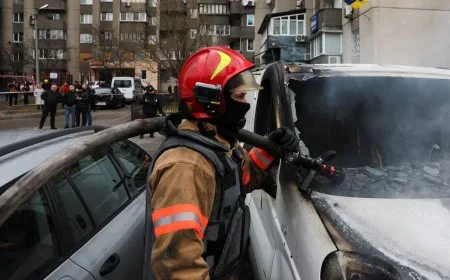 An emergency worker extinguishes fire in vehicles at the site of a Russian missile strike, amid Russia’s attack on Ukraine, in Kyiv, Ukraine March 9, 2023. REUTERS/Gleb Garanich
