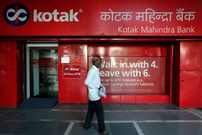 A man walks past the Kotak Mahindra Bank branch in New Delhi, India, September 6, 2017. REUTERS/Adnan Abidi