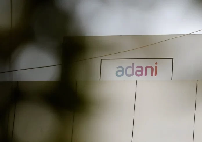 The logo of the Adani Group is seen on one of its buildings in Ahmedabad, India, January 27, 2023. REUTERS/Amit Dave