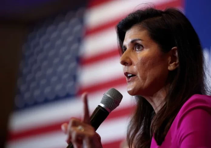 Nikki Haley, the former Governor of South Carolina and Ambassador to the UN, stumps for Virginia gubernatorial candidate Glenn Youngkin (R-VA), during a campaign event in McLean, Virginia, U.S., July 14, 2021. REUTERS/Evelyn Hockstein/File Photo