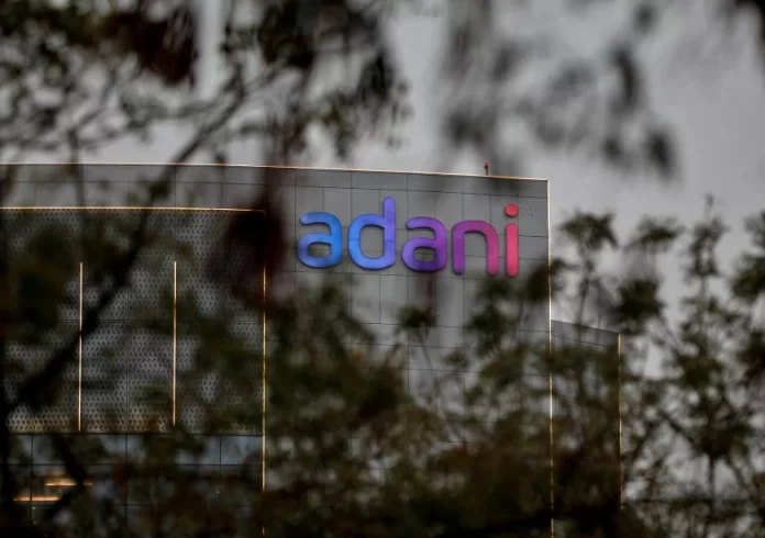 The logo of the Adani Group is seen on the facade of its Corporate House on the outskirts of Ahmedabad, India, January 27, 2023. REUTERS/Amit Dave/File Photo