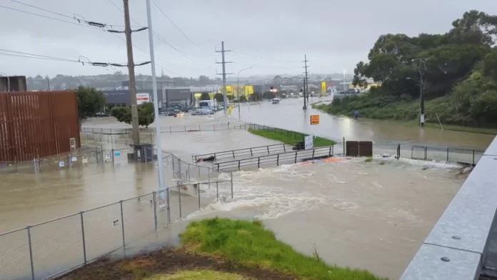 An area flooded during heavy rainfall is seen in Auckland, New Zealand January 27, 2023, in this screen grab obtained from a social media video. @MonteChristoNZ/via REUTERS/File Photo
