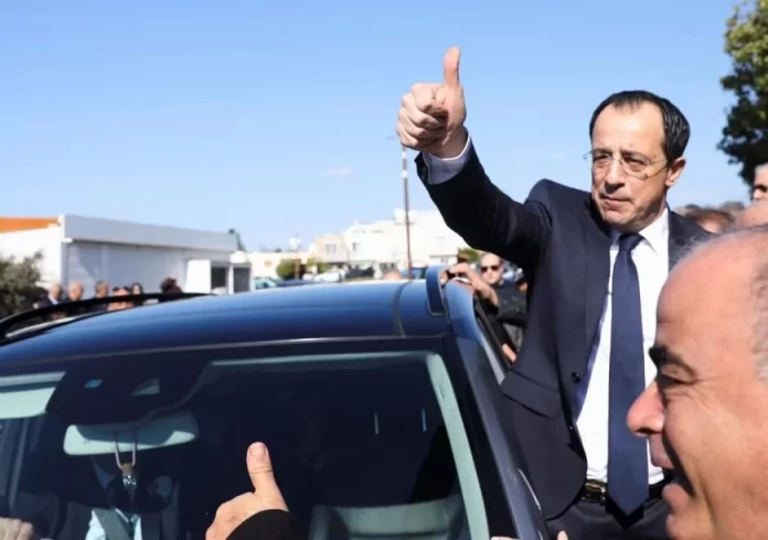 Presidential candidate Nikos Christodoulides gestures outside a polling station during the second round of the presidential election in Geroskipou near Paphos, Cyprus, February 12, 2023. REUTERS/Yiannis Kourtoglou