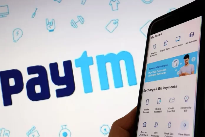 The interface of Indian payments app Paytm is seen in front of its logo displayed in this illustration picture taken July 7, 2021. REUTERS/Florence Lo/Illustration