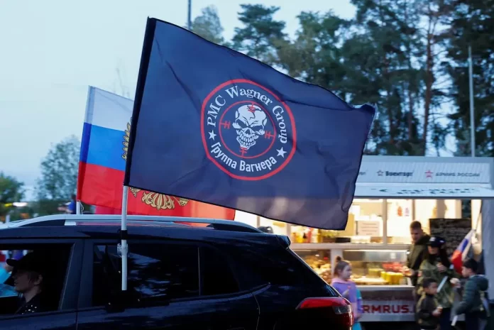 A flag with the logo of Wagner private mercenary group is attached to a car during an automobile rally at a patriotic festival marking Russia's National Flag Day in the Moscow region, Russia, August 23, 2023. REUTERS/Yulia Morozova