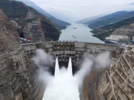The Baihetan hydropower plant is seen in operation on the border between Qiaojia county of Yunnan province and Ningnan county of Sichuan province, China June 28, 2021. Picture taken with a drone. cnsphoto via REUTERS/File Photo