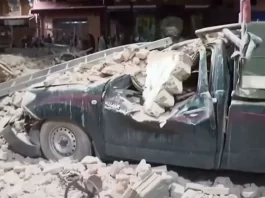 View of a damaged car and debris from the earthquake in Marrakech, Morocco September 9, 2023 in this screen grab taken from a video. Al Oula TV/Handout via REUTERS